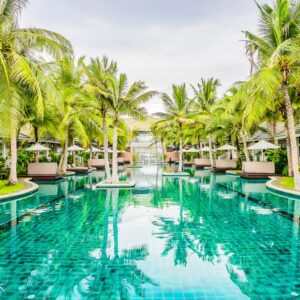 Outdoor Swimming pool in hotel resort for summer vacation background